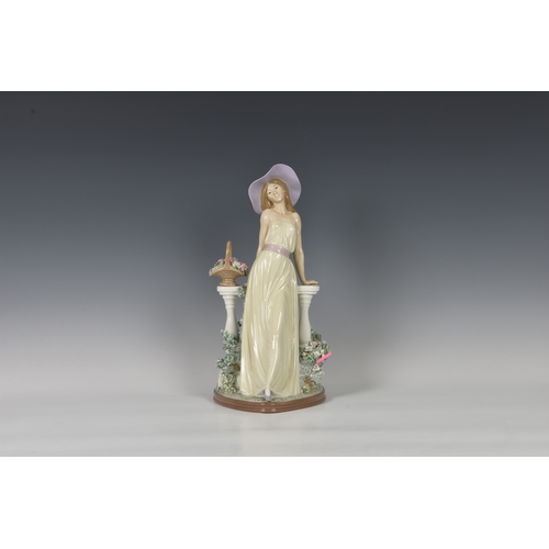 103 - A large Lladro figurine 'Time for Reflection', young lady modelled standing, leaning against balustr... 