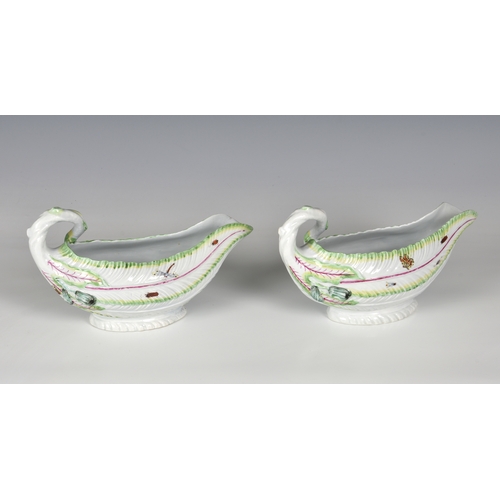 113 - A pair of Worcester porcelain lettuce leaf sauce boats, probably first period, with moulded leaf tex... 