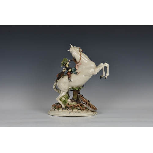 114 - A Capodimonte porcelain group of children on horseback, titled 'Far West', by Tiziano Galli, 14½in. ... 