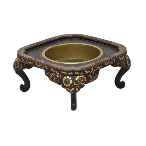 1242 - A Japanese Hibachi charcoal brazier, the inset brass liner in a black lacquered stand decorated with... 