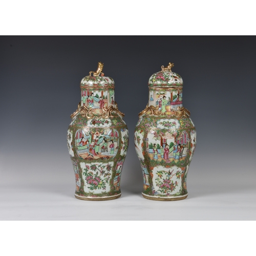 1247 - A closely matched pair of 19th century Chinese Canton famille rose covered vases, the vases of balus... 