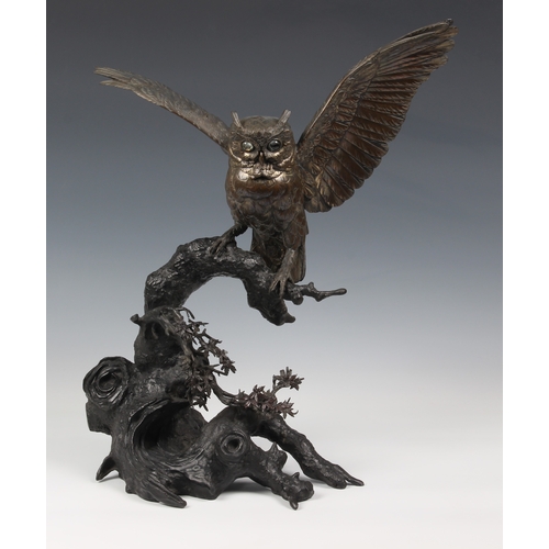 1250 - A Japanese silvered bronze okimono of an owl, Meiji period (1868-1912), the silvered owl with inset ... 