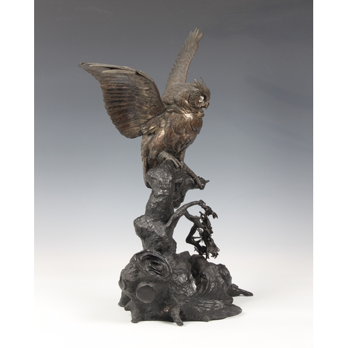 1250 - A Japanese silvered bronze okimono of an owl, Meiji period (1868-1912), the silvered owl with inset ... 