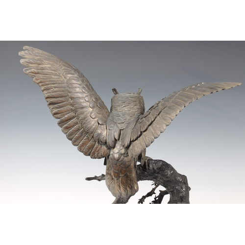 1250 - A Japanese silvered bronze okimono of an owl, Meiji period (1868-1912), the silvered owl with inset ... 