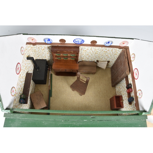 1271 - A scratch built dolls house in the form of a bay window cottage, the roof lifts off, the front openi... 