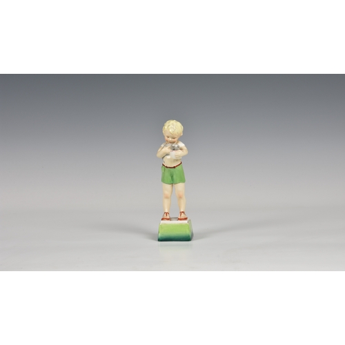 129 - A Royal Worcester Days of the week figure, No.3281, Friday's child is loving and giving (boy with ki... 