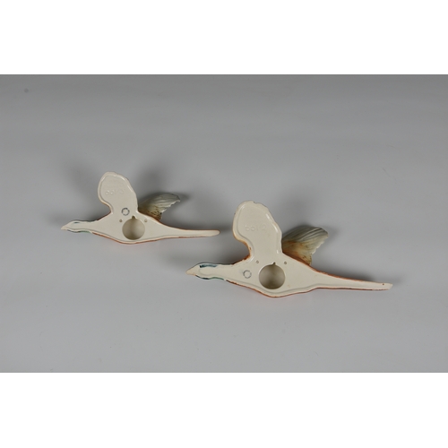 133 - A pair of Beswick Flying Pheasant wall plaques, 20th century, numbered 661/2 & 661/3. (2)