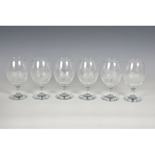 141 - A set of six etched wine glasses in the style of Rowland Ward, each etched with a different African ... 