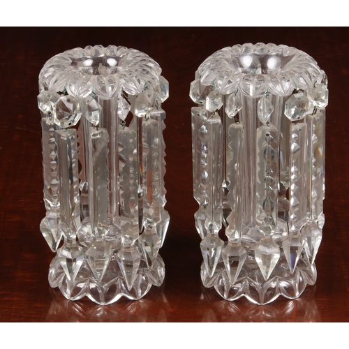 144 - A pair of Victorian clear glass table lustres, each having flower head to tapering hexagonal columns... 