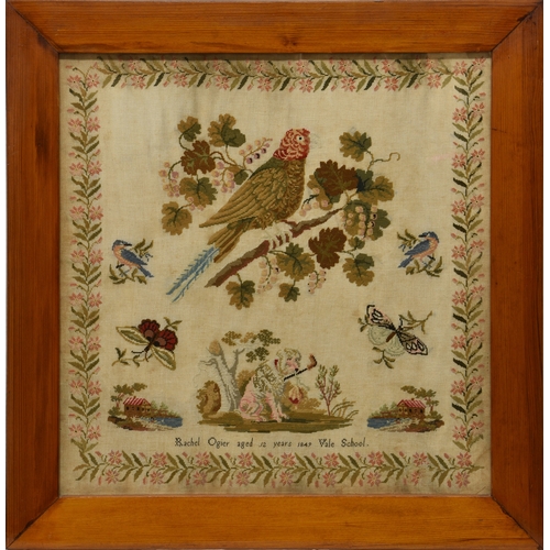 1463 - A framed Victorian needlework sampler, with a floral border and dog, bird and butterfly main panel w... 