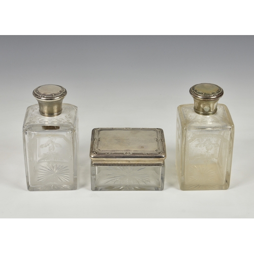 154 - A pair of French wheel engraved and silver mounted square glass flasks, together with matching recta... 