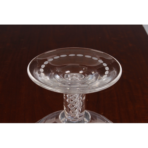 173 - A large 19th century glass pedestal footed bowl, with air-twist stem, the bowl with a deep band of e... 