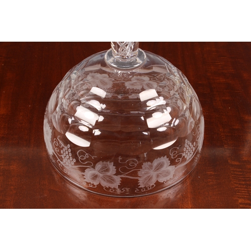 173 - A large 19th century glass pedestal footed bowl, with air-twist stem, the bowl with a deep band of e... 