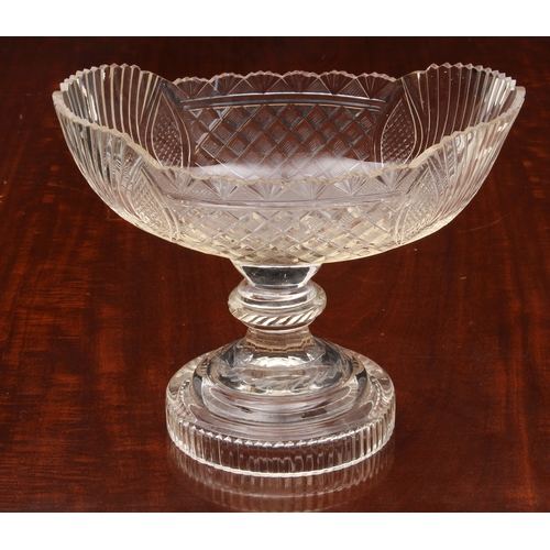 174 - A pair of Georgian cut glass navette pedestal dishes, on knopped stems and raised on round stepped b... 