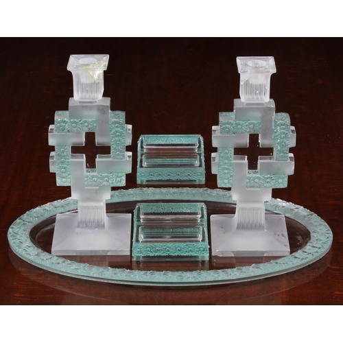 175 - An early 20th century five piece Lalique glass dressing table set, comprising an oval tray with a ba... 