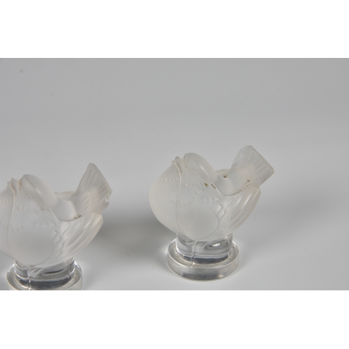 180 - A Lalique frosted glass goblet form vase with a band of raised sparrows among foliage, Created in 19... 