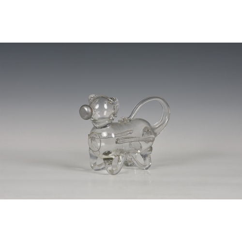 183 - A late 19th century novelty glass decanter fashioned as a dog, his tail forming the handle and nozzl... 