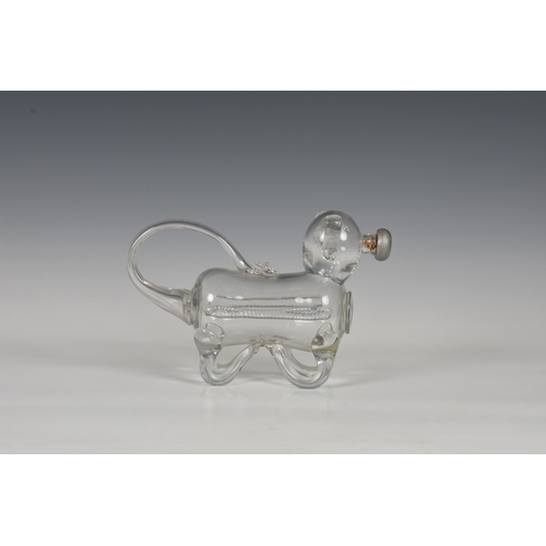 183 - A late 19th century novelty glass decanter fashioned as a dog, his tail forming the handle and nozzl... 