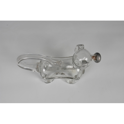 183 - A late 19th century novelty glass decanter fashioned as a dog, his tail forming the handle and nozzl... 