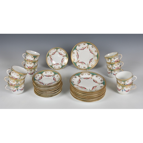 24 - A 19th century English porcelain part tea service, decorated with floral swags on a five lobed flowe... 