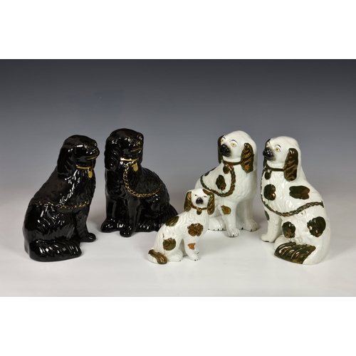 26 - A group of five 19th century Staffordshire dogs, comprising a pair in black glaze with gilt highligh... 