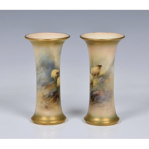 3 - A pair of Royal Worcester porcelain sheep painted trumpet spill vases by Harry Davis, each painted w... 