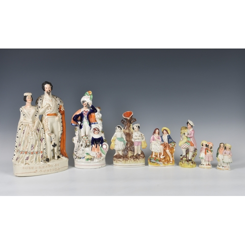 31 - A collection of Staffordshire flatback figures, the largest 'QUEEN & KING OF SARDINIA', 13¼in. (33.6... 