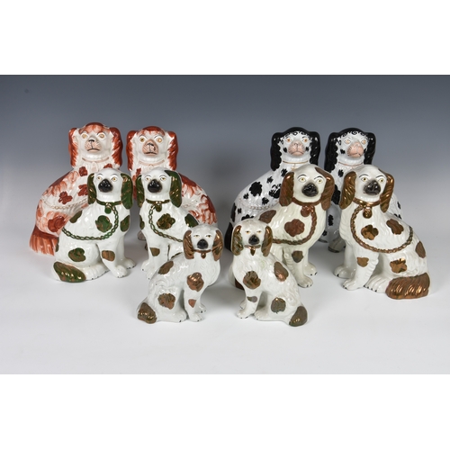 32 - Five pairs of Staffordshire dogs, each pair with traditional embellishments, chain and separated fro... 