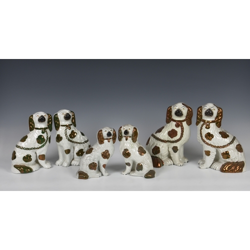 32 - Five pairs of Staffordshire dogs, each pair with traditional embellishments, chain and separated fro... 