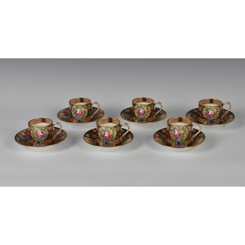 34 - A set of six Crown Staffordshire coffee cans & saucers, floral decorated with gilt highlights on cob... 