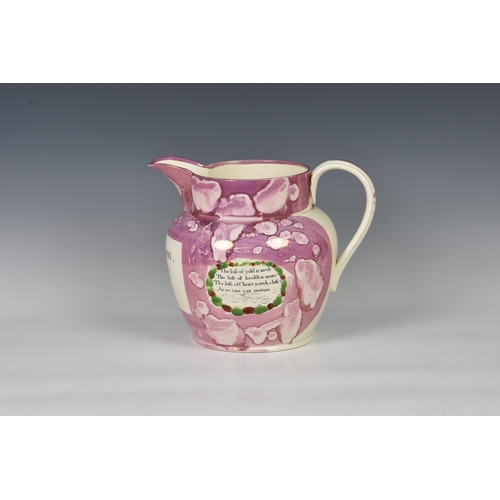 36 - A large early nineteenth century Sunderland pink lustre christening jug, painted and transfer printe... 