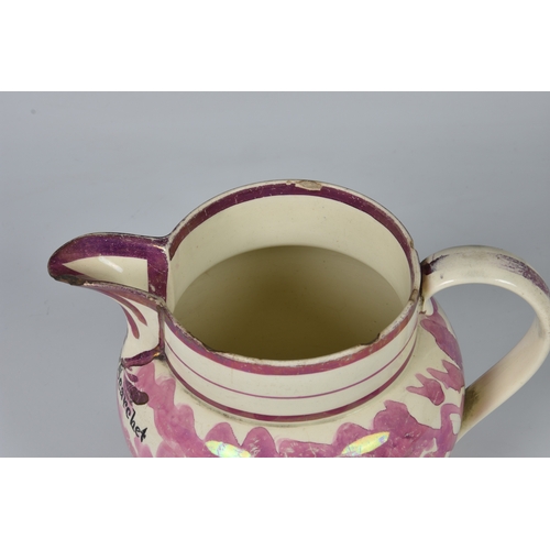 37 - Three Sunderland pink lustre jugs, to include a large early nineteenth century Sunderland pink lustr... 