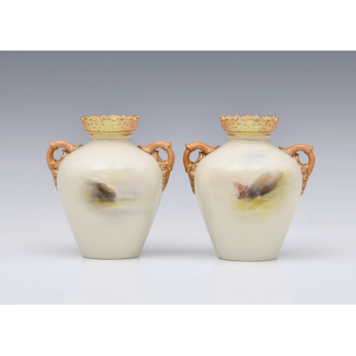 4 - A pair of Royal Worcester porcelain highland cattle painted twin handled vases by Harry Stinton, one... 