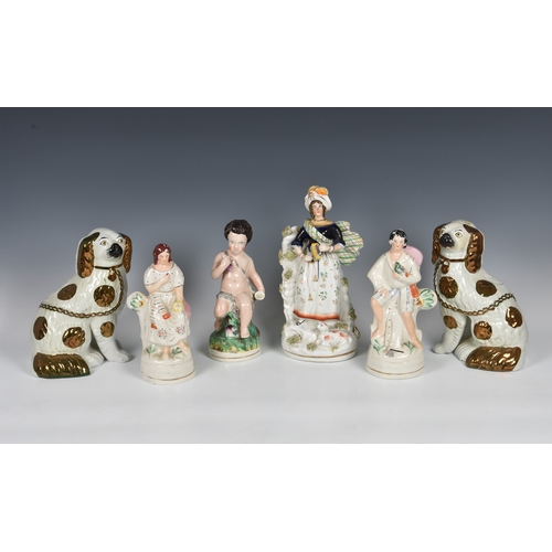 41 - A collection of Staffordshire Pottery figures, to include a figure of young Bacchus sitting on tree ... 