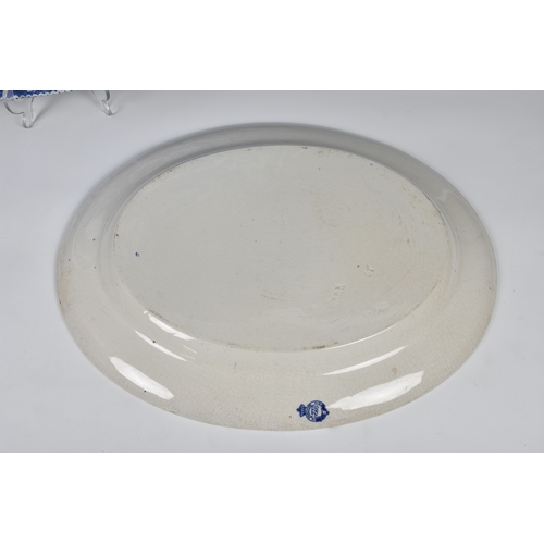 42 - An early 19th century large blue and white pottery meat platter, printed with 'Wild Rose' pattern, 2... 