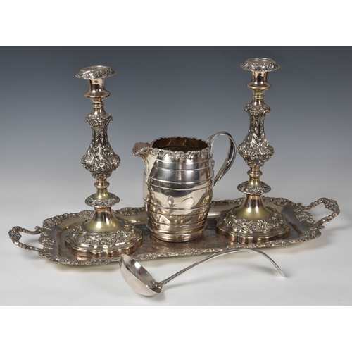 422 - A pair of large silver plated table candlesticks, marked 'Sheffield Plate', with foliate scroll deco... 