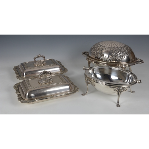 423 - A pair of silver plated covered entree dishes, with foliate reeded borders and detachable, foliate h... 