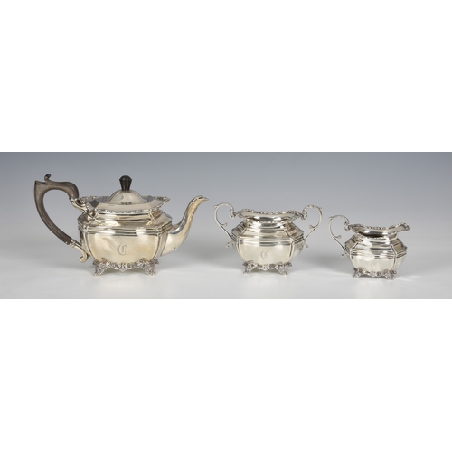 426 - An Edwardian silver three piece bachelor's tea service, Josiah Williams & Co., London 1911, retailer... 