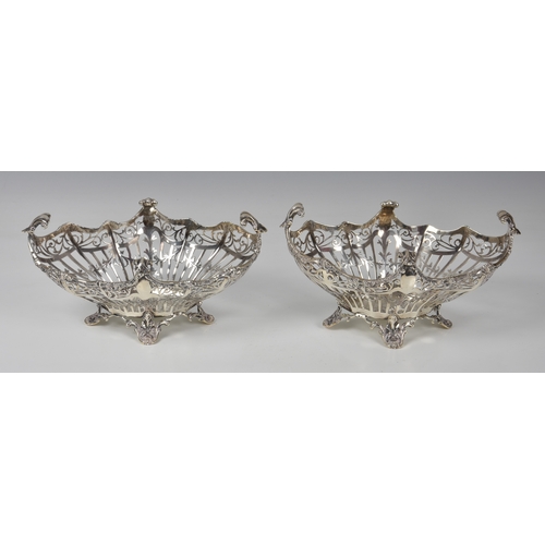 427 - A pair of Edwardian pierced silver bon-bon baskets, Josiah Williams & Co., London 1911, retailer's m... 