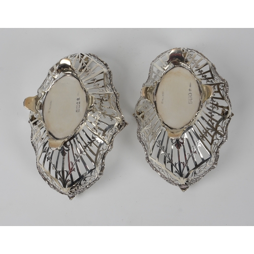 427 - A pair of Edwardian pierced silver bon-bon baskets, Josiah Williams & Co., London 1911, retailer's m... 