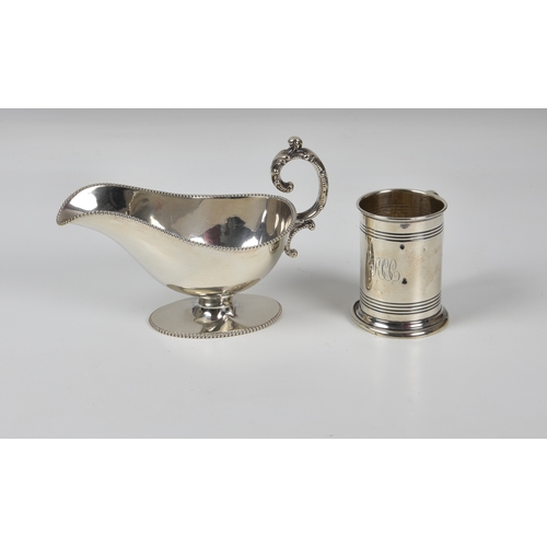 429 - A sterling silver gravy boat, Birks (Canada) silver marks, with beaded borders and joined foliate sc... 