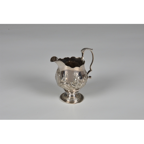 438 - A late-George II silver pedestal cream jug, Walter Brind, London 1758, of bellied form with cut card... 