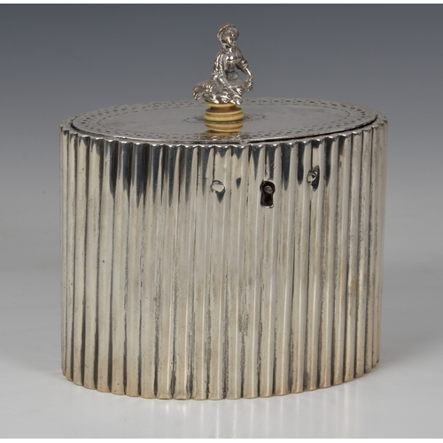 442 - A George III silver tea caddy, Robert Hennell I, London 1784, of reeded, oval form, the hinged lid w... 