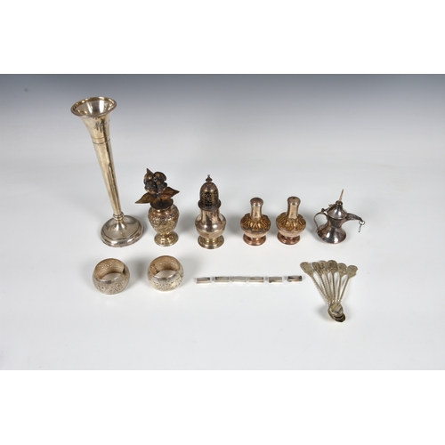 444 - A small collection of silver, to include an early George III pepper caster, London 1761; a sterling ... 