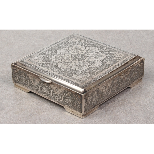 449 - A Persian silver lidded box, probably early 20th century, of square form, chased with a large floral... 