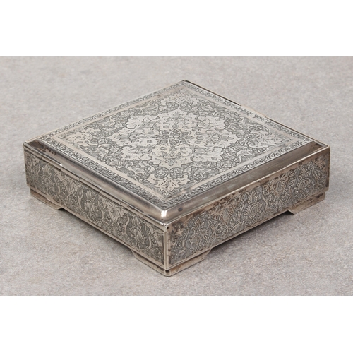 449 - A Persian silver lidded box, probably early 20th century, of square form, chased with a large floral... 