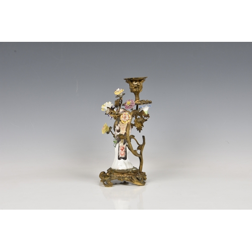 48 - A Samson porcelain ormolu-mounted bird candlestick, 19th century, composed of a porcelain bird stand... 