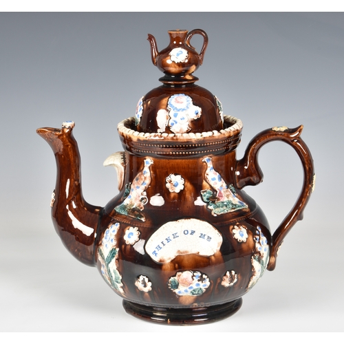 50 - A Victorian barge ware teapot, inscribed "Think of Me", the stoneware body with typical tr... 