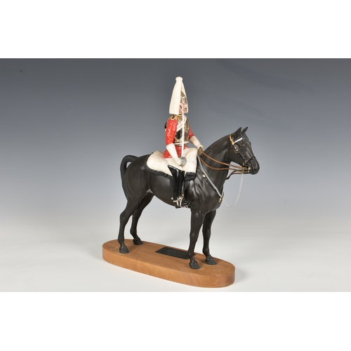 58 - Beswick Porcelain Life guard on Horseback, on a wooden stand. Beswick mark on underside of horse. 14... 