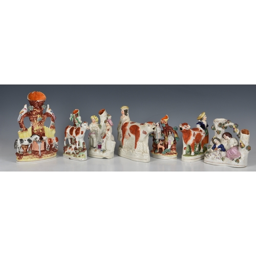 63 - A collection of Staffordshire Spill Vases, one in the form of a horse and cow drinking from a trough... 